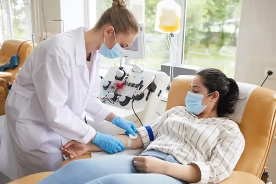 Healthcare Professional Administering Treatment to a Patient in a Clinic